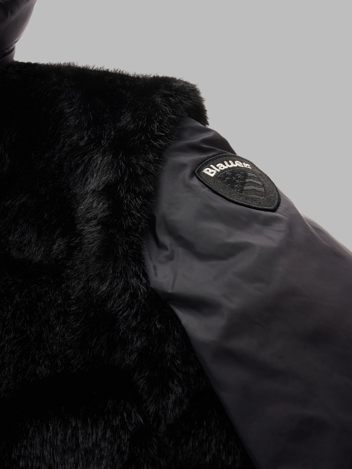 Giubbino eco pelliccia e nylon Juniper nero